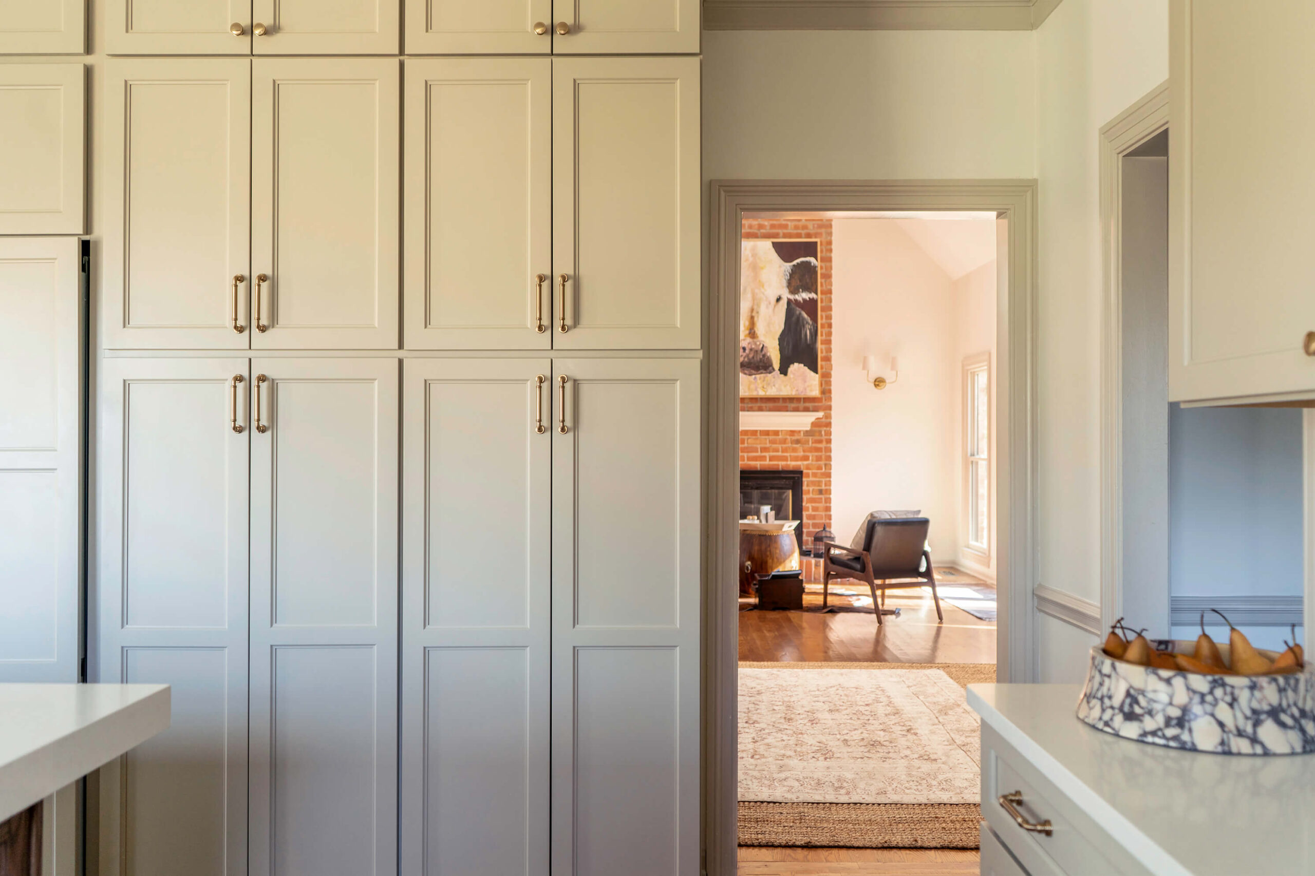 Custom kitchen cabinetry for a luxury home design by Holly Thompson Design. Painted cabinetry with custom hardware.