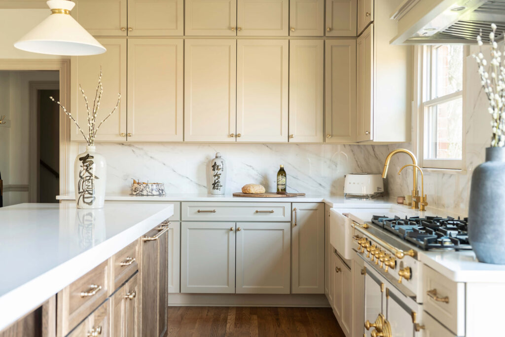 Luxury kitchen design by Holly Thompson Design, with painted custom cabinets, a La Cornue range and apron front sink.