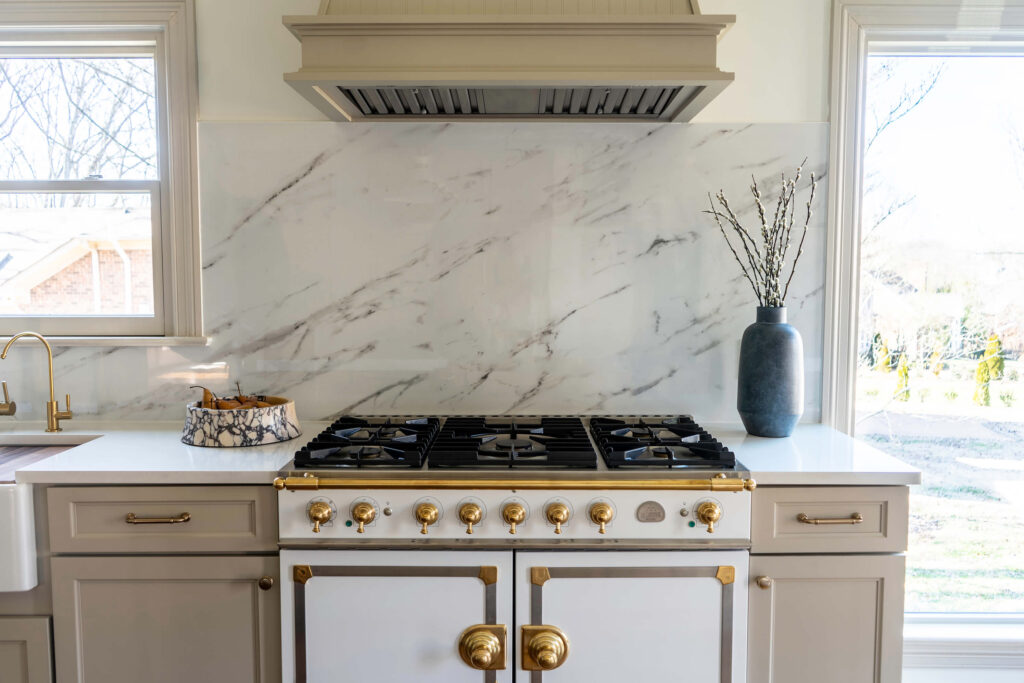 A custom La Cornue range in a luxury home design kitchen by Holly Thompson Design.